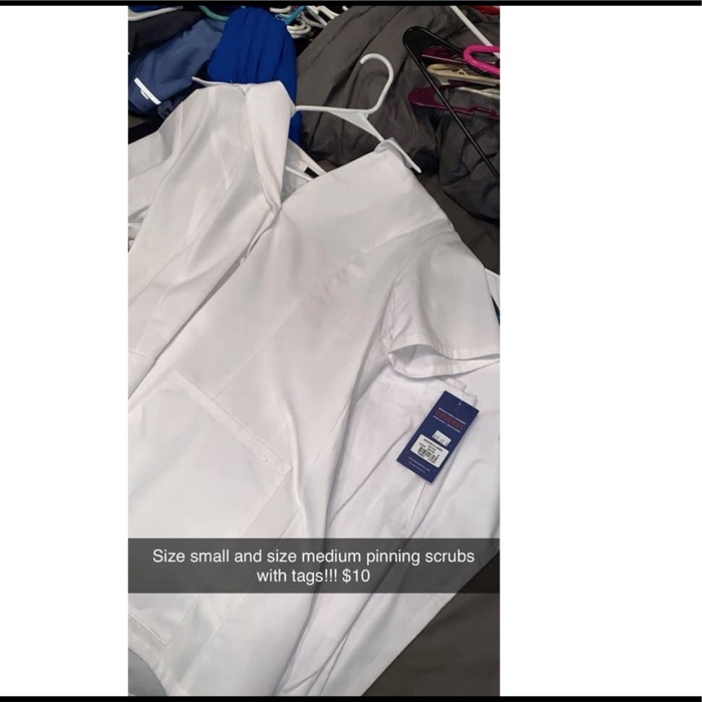 New with tags white scrubs!! Size small pants with medium top.